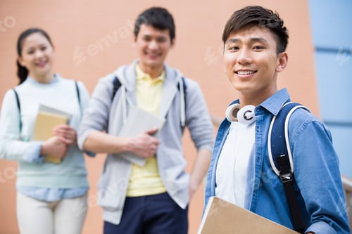 Preview: Young college students outside library