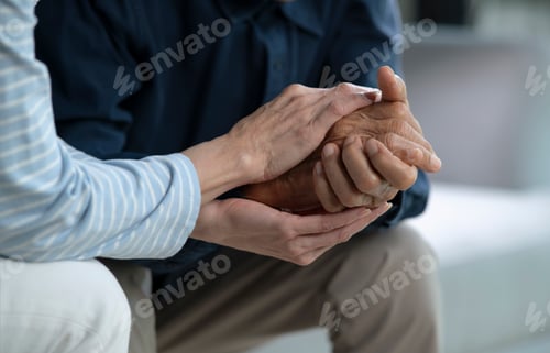 Preview: Caregiver Supporting Senior Adult with Hand Holding