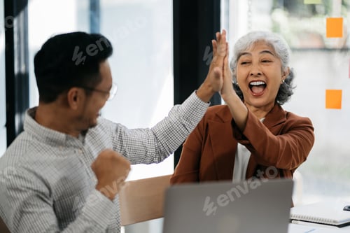 Preview: Happy creative business people are motivated, giving high five and celebration successful deal.