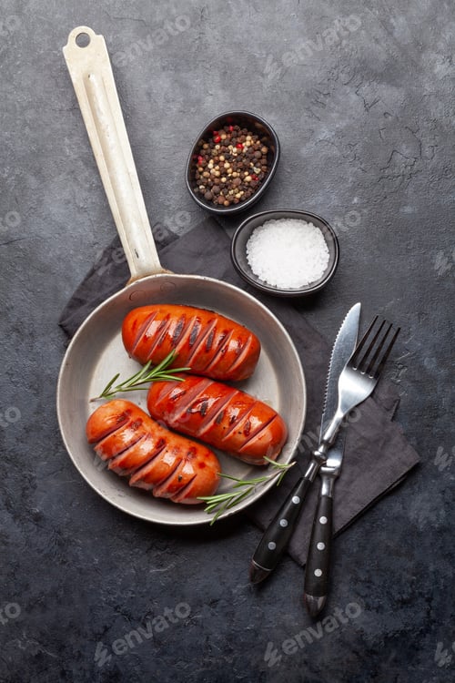 Preview: Hot grilled sausages in a frying pan