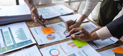 Preview: Asian business colleagues meeting to analyze financial reporting situation Investment and accounting
