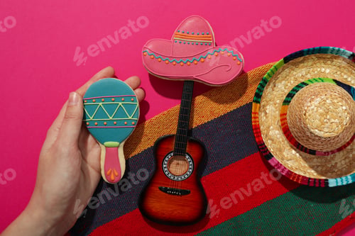 Preview: Mexican sombrero with a decorative guitar on a pink background