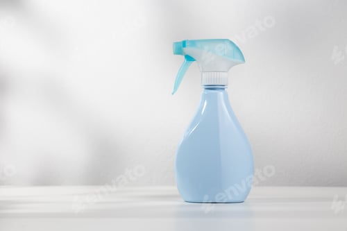Preview: Blue Spray Bottle on White Surface with Shadow
