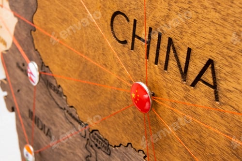 Preview: China flag on the pushpin and red thread on the wooden map, close up