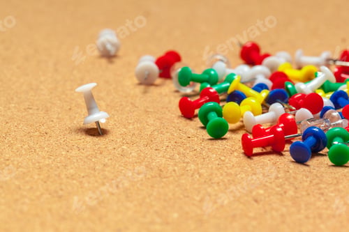 Preview: Group of thumbtacks on corkboard close up. School or business concept