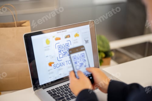Preview: Man using smartphone for payment in online store