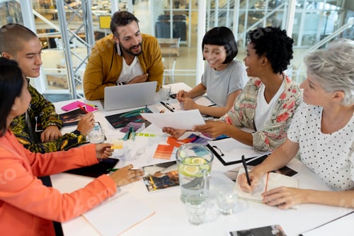 Preview: Side view of diverse business people discussing in the meeting at conference room in office