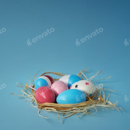 Preview: Decorated Eggs in a Nest on Blue Background