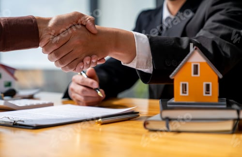 Preview: Successful deal Real estate lease or home purchase concept buyer shakes hands with bank employee aft