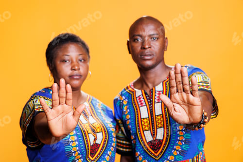 Preview: Serious couple wshowing stop gesture