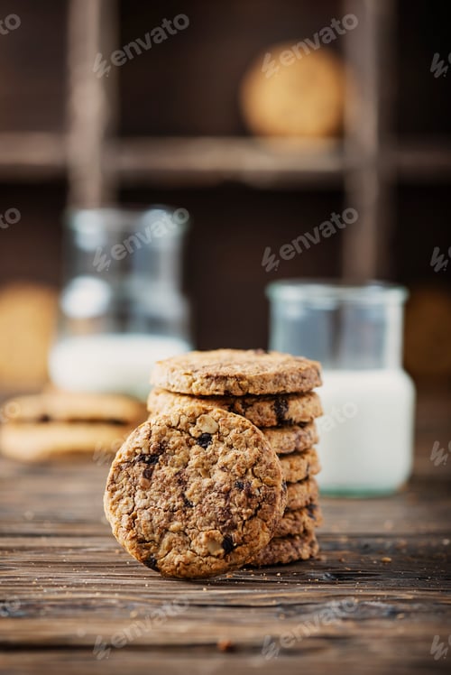 Preview: Stack of Cookies on Wooden Table with Milk