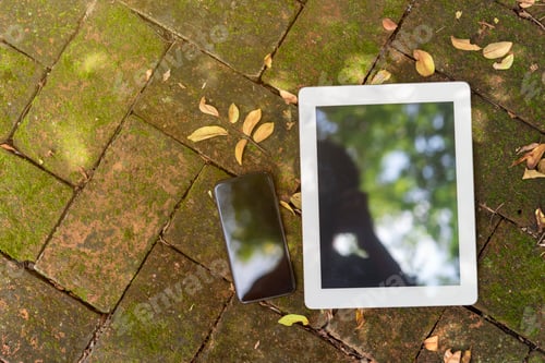 Preview: Blank screen of mobile and tablet put on wood in nature outdoor.