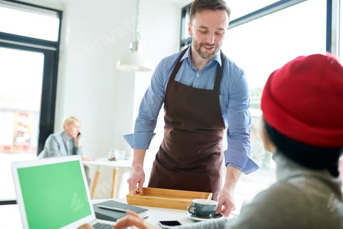 Preview: Handsome Waiter Serving Client