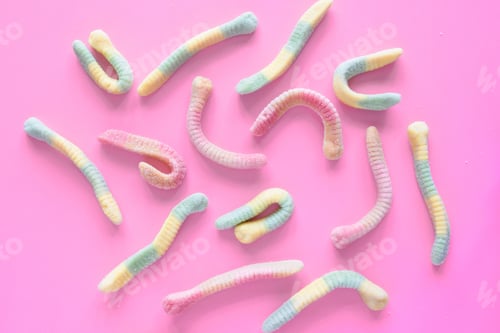 Preview: Gummy worms candy on pink background