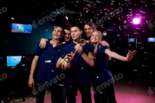 Preview: Group of five teenagers celebrating their victory in cybersports competition