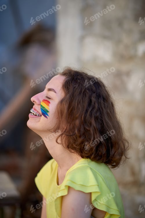 Preview: Girl with pride flag painted on her cheeks