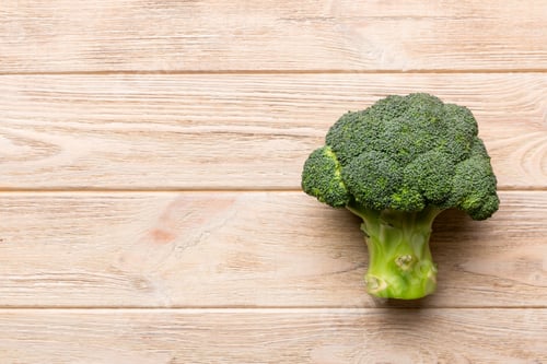 Preview: Top view fresh green broccoli vegetable on Colored background. Broccoli cabbage