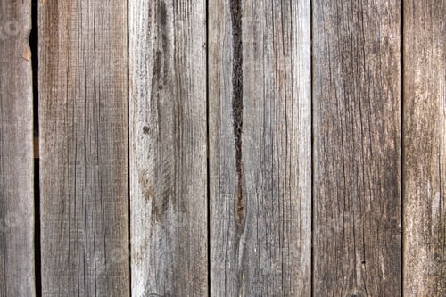 Preview: Close-up of natural old vintage weathered gray brown unpainted solid wooden fence