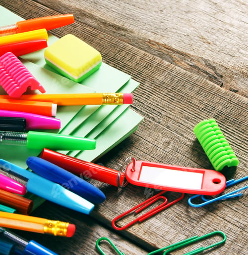 Preview: School tools. On wooden background.