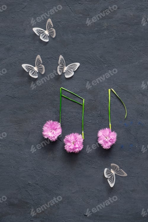 Preview: Butterflies and music notes from flowers and stems on dark background. Musical creative concept