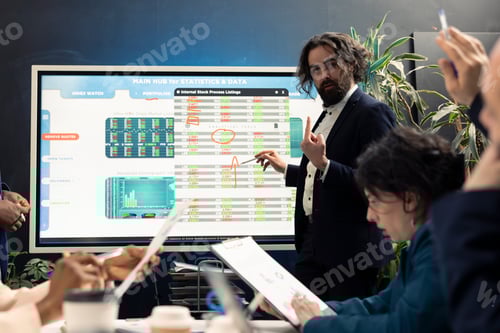 Preview: Financial expert briefing his team members about new corporate objectives