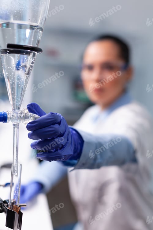 Preview: Specialist chemist woman working at biochemistry experiment using professional biology tools