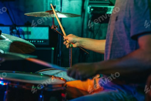 Preview: Drummer Performing in a Smoky Stage Setting