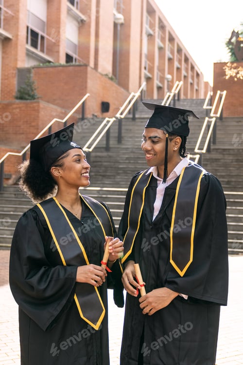 Preview: Diverse students celebrating graduation holding diplomas