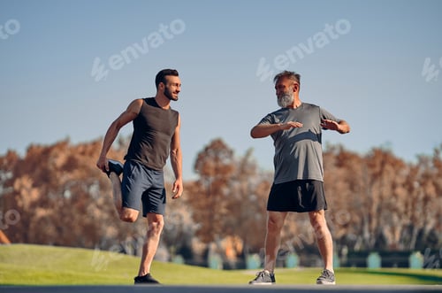 Preview: The young and old athletes stretching outdoor.