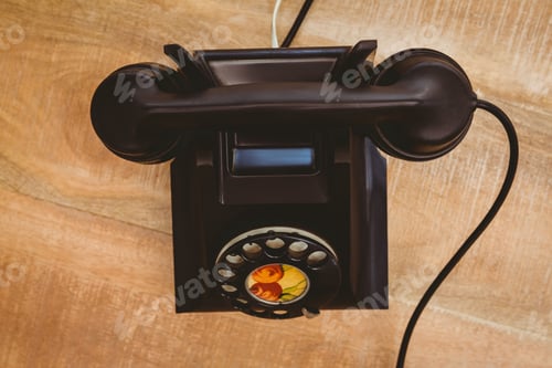 Preview: View of an old phone on wood desk