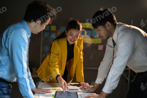 Preview: Business Team Collaborating on Project in Modern Office with Sticky Notes and Diagrams