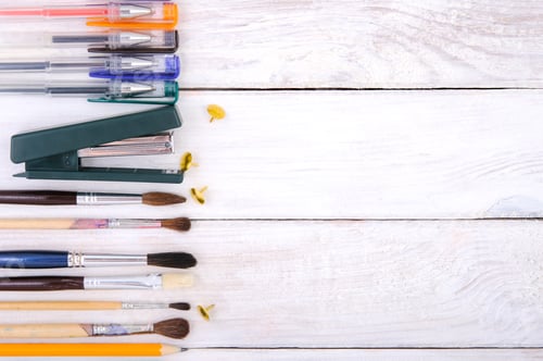 Preview: Stationery on a white wooden plank table.