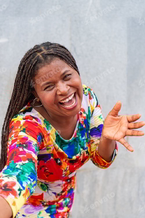 Preview: Black woman with braids laughs in the street