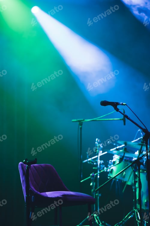 Preview: Colorful stage lights and microphone at concert