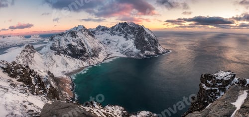 Preview: Panorama of Snowy mountain range with coastline at sunset