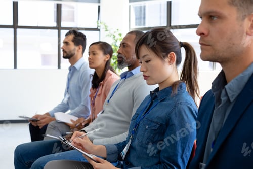 Preview: Business professionals at a conference