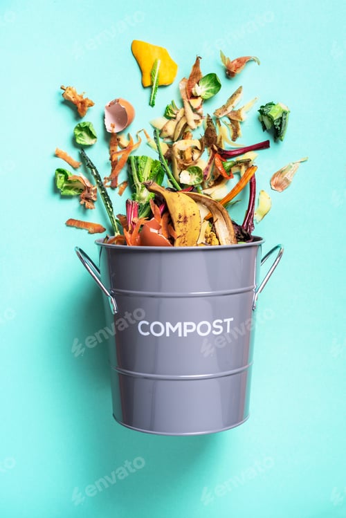 Preview: Peeled vegetables in white compost bin on blue background. Trash bin for composting with leftover