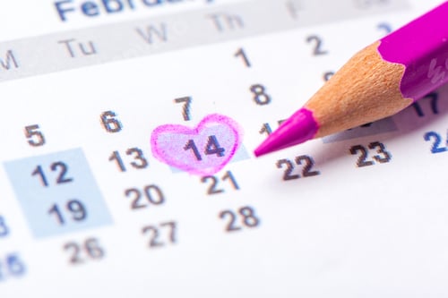 Preview: Marking an important date on a calendar with a colored pencil in February