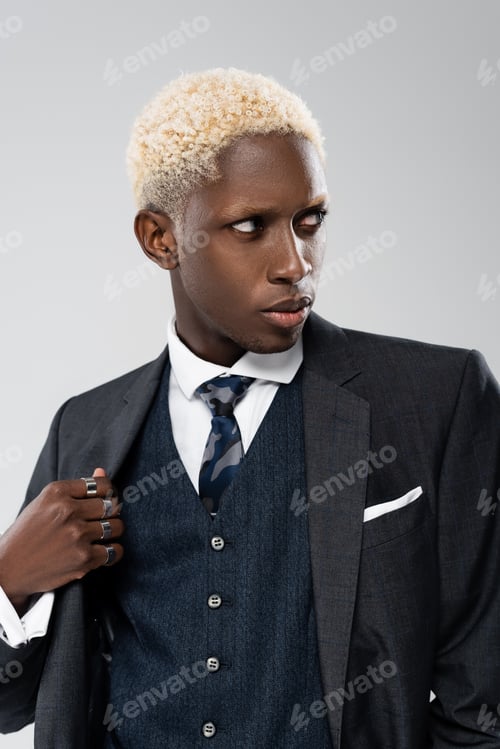 Preview: elegant african american man in formal wear looking away isolated on grey