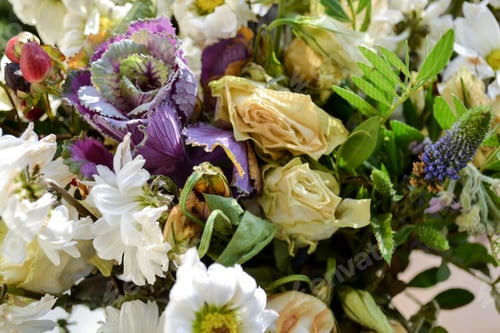 Preview: Close-up of a wilted bouquet of white roses, chrysanthemums, purple cabbage, greens. The end