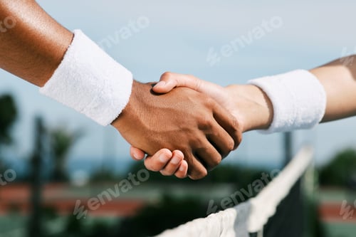 Preview: Shot of two unrecognizable tennis players shaking hands during a tennis match