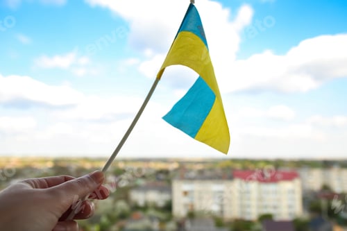 Preview: Ukraine flag. Large national symbol fluttering in blue sky. Small yellow blue Ukrainian state flag,