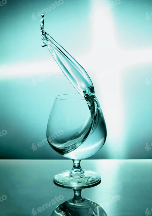Preview: Glass of water with a wave on a blue background