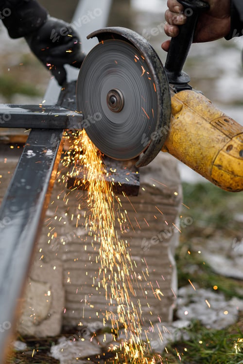 Preview: Close up of man grinding metal with circular grinder disc and electric sparks
