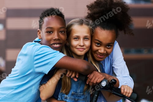 Preview: Two African American kids embracing their Caucasian friend
