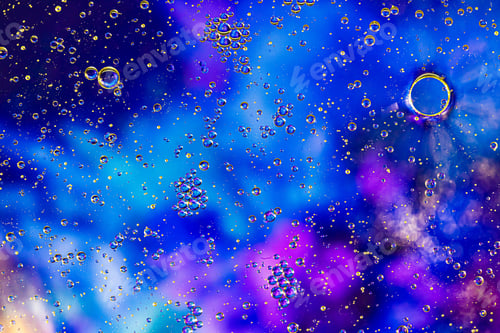 Preview: Blue background with oil circles . Bubbles of water. Close up