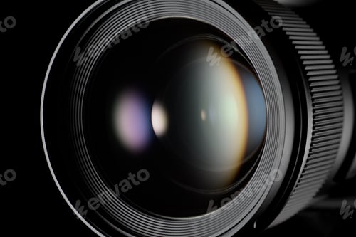 Preview: Close-up shot of one digital camera lens with light reflex on a black background.