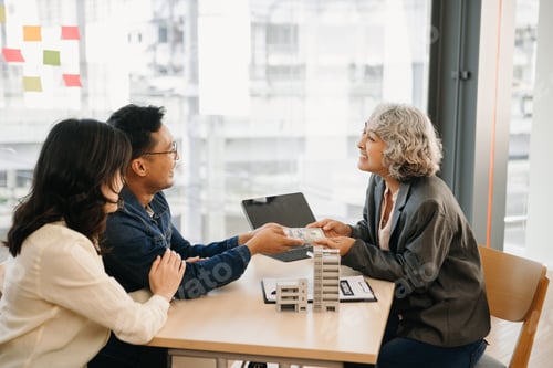 Preview: A family couple sign a lease meeting with a realtor or homeowner, purchase the first mortgage