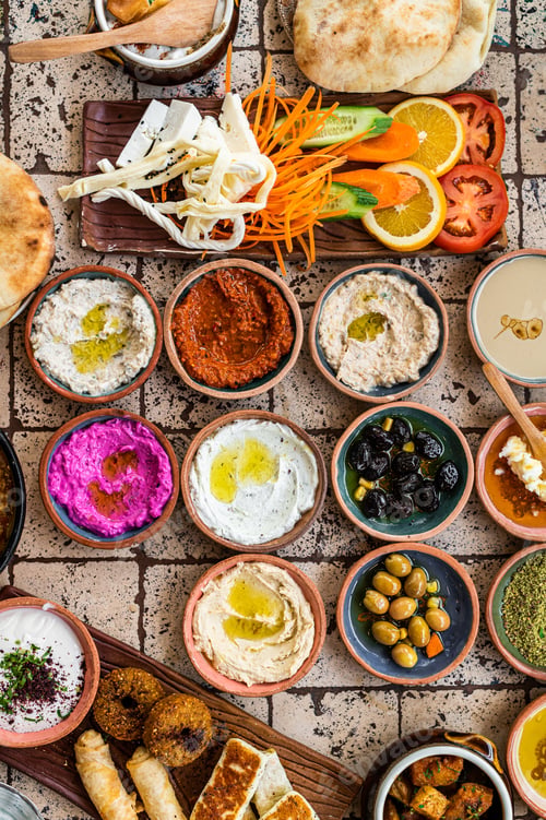 Preview: Traditional Turkish Village Breakfast on the ceramic table with pastries, vegetables, greens, spread