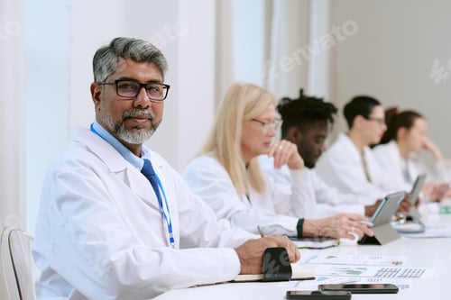 Preview: Portrait of Middle Aged South Asian Man Attending Medical Conference Meeting